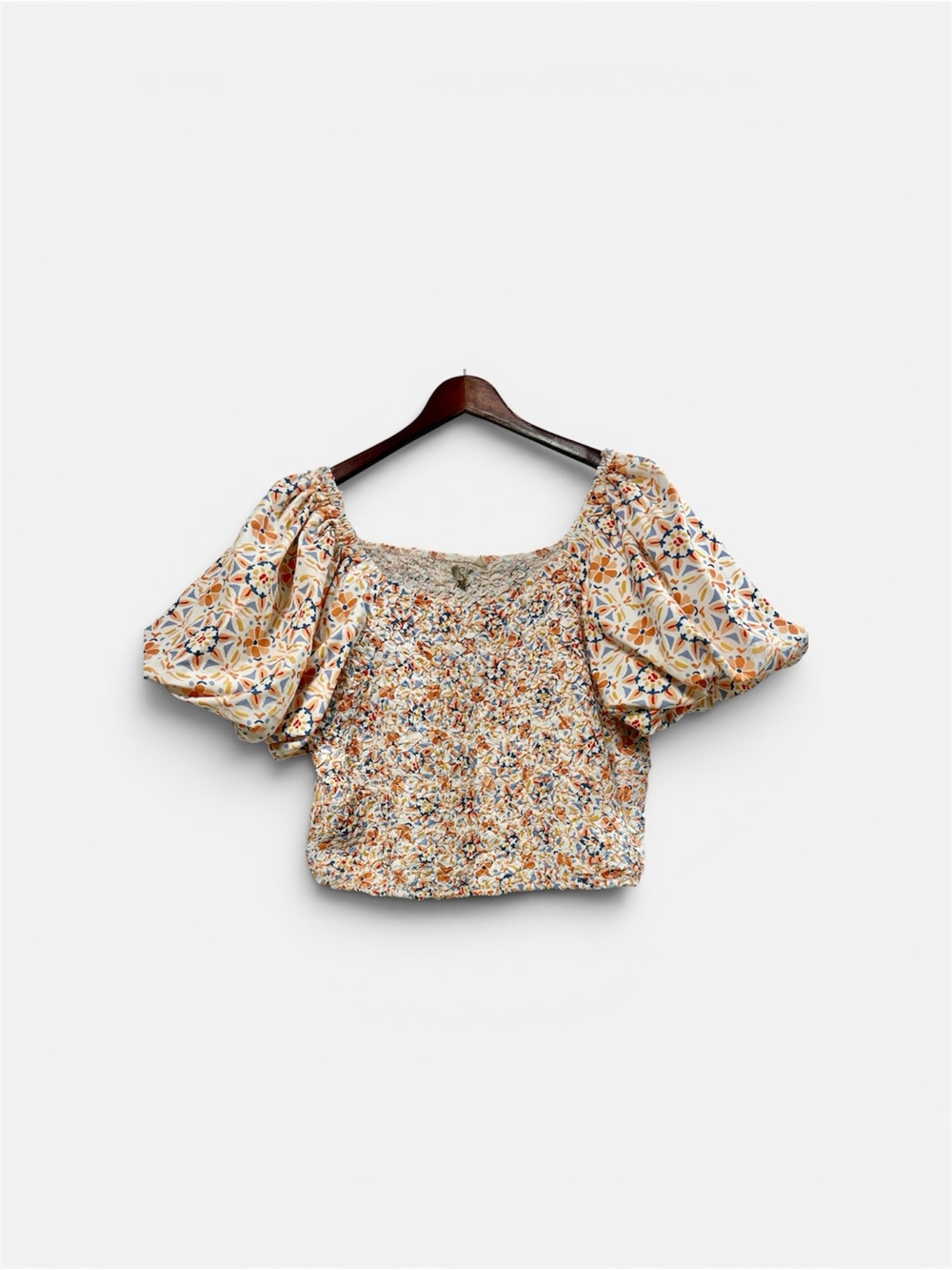 Anthropologie Dolan crop top in a multicolor floral print.